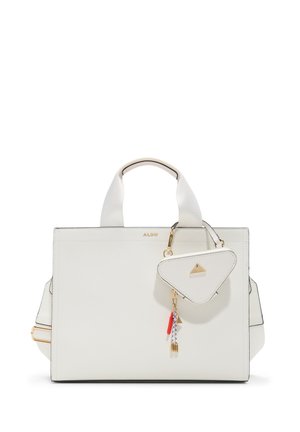 White leather handbag with structured design, dual handles, a detachable triangle charm, and gold hardware accents. Notable black border detailing.