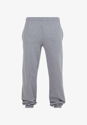 Grå sweatpants lavet af blødt stof, med elastisk talje, sidelommer og tapered manchetter ved anklerne for en afslappet pasform.