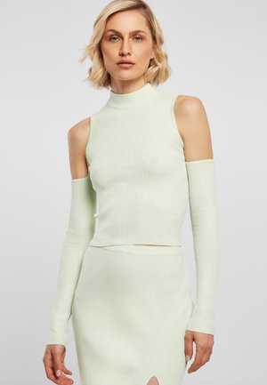 Lys grøn ribbet genser med høy hals og kald skulder-design. Lange ermer og cropped lengde, laget av et mykt strikket materiale.