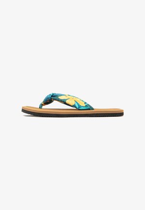 Flip-flop with a teal fabric strap featuring yellow floral design; cushioned tan footbed; black textured outsole for grip.