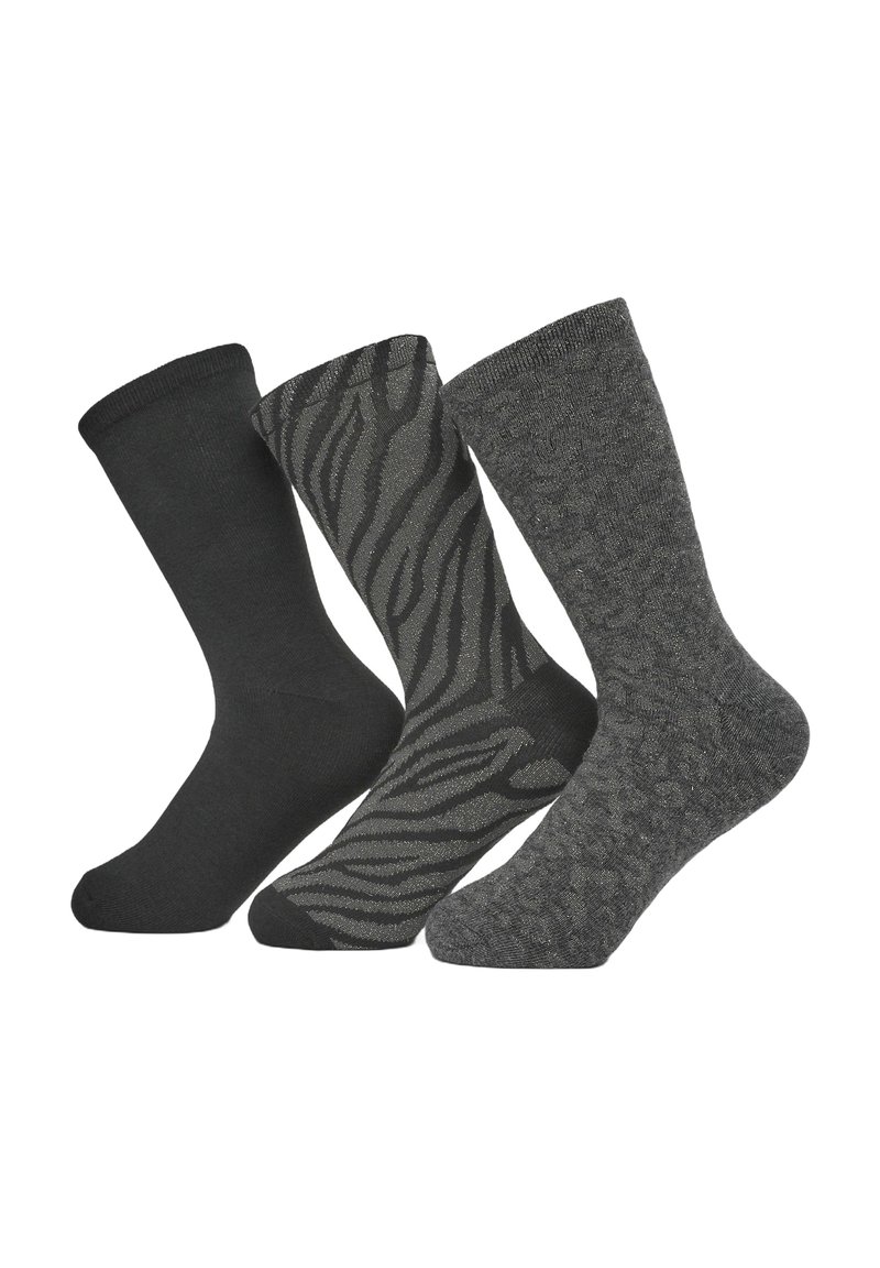 Tre paia di calze: nere unite, nere con un motivo a strisce zebra e grigie scure con un design testurizzato. Tutte hanno polsini a coste.