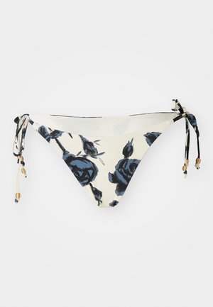 Parte de baixo de biquíni em creme com padrão floral azul-marinho; apresenta laços ajustáveis nas laterais com pequenas contas metálicas como detalhe.