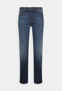 Mörkblå jeans i denim, med rak bendesign, subtila blekningar, fem fickor och orange sömdekorationer.