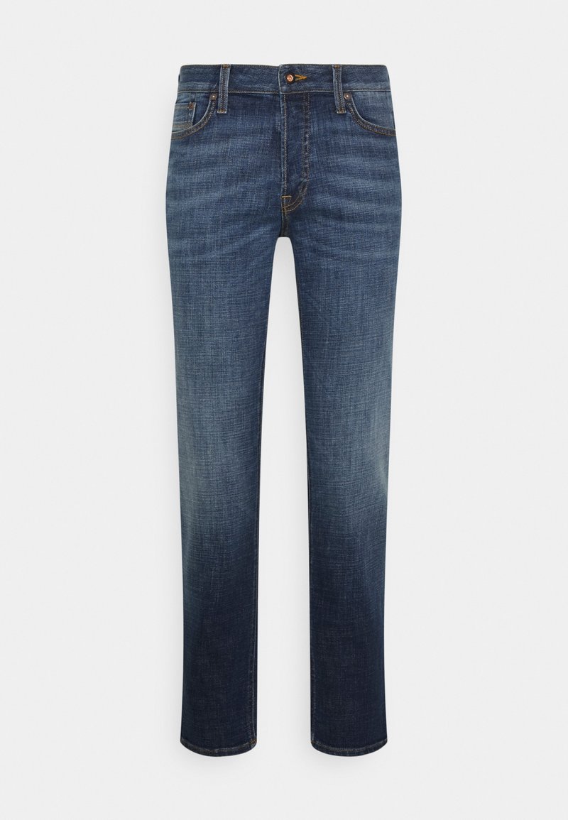 Mörkblå jeans i denim, med rak bendesign, subtila blekningar, fem fickor och orange sömdekorationer.