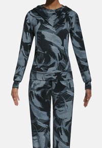 Sportowa bluza z kapturem i dopasowane spodnie w ciemnoniebieskim kolorze z kwiatowym wzorem. Wykonane z teksturowanej tkaniny, wyposażone w kieszenie na suwak oraz dopasowane mankiety.