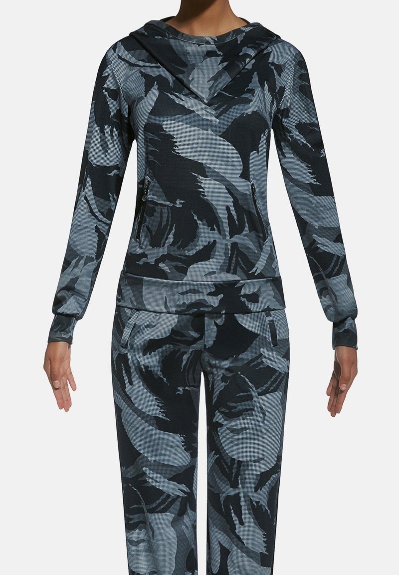 Sportowa bluza z kapturem i dopasowane spodnie w ciemnoniebieskim kolorze z kwiatowym wzorem. Wykonane z teksturowanej tkaniny, wyposażone w kieszenie na suwak oraz dopasowane mankiety.