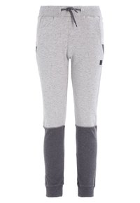 Pantalones de chándal grises con paneles oscuros en las rodillas, cintura acanalada con cordón, bolsillos laterales y puños en los tobillos.