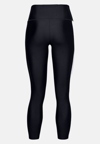 Czarne legginsy z wysokim stanem wykonane z elastycznego materiału; mają gładką fakturę i dopasowany krój, z bezszwowym tyłem i bez widocznych elementów metalowych.