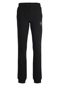Schwarze Jogginghose aus weichem Stoff, mit einem elastischen Bund mit Kordelzug, gerippten Bündchen und einem runden Logo am Oberschenkel.