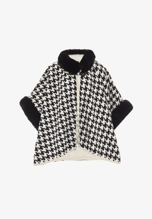 Cappa a motivo houndstooth in bianco e nero, con bavero e polsini in pelliccia sintetica, rifinita con dettagli intrecciati lungo i bordi del davanti.