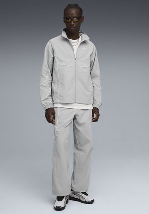 PUMATECH-X RELAXED TRACK PANT - Tracksuit bottoms - gray echo/puma white