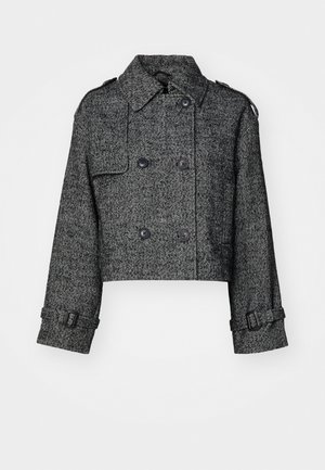 Kraftet dobbelspent jakke i svart og grå hakke mønster, med store knapper, sidelommer og justerbare mansjetter.