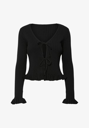 Haut noir en maille côtelée à manches longues avec col en V, deux fermetures à nouer à l'avant, ourlet volanté et poignets volantés.