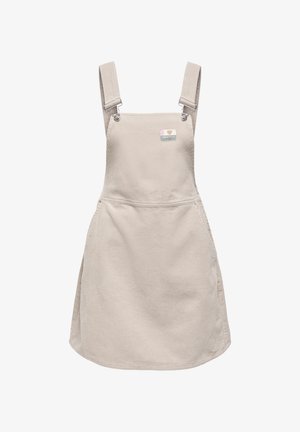 Beiges Cordkleid aus Cordstoff mit verstellbaren Schulterriemen und einem kleinen bunten Aufnäher im Brustbereich.