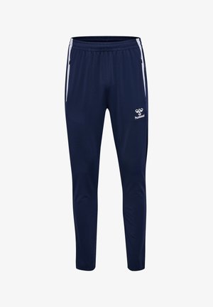 Marineblauwe sportbroek met witte zijstrepen, elastische tailleband, ritszakken en wit Hummel-logo op de rechterdij.