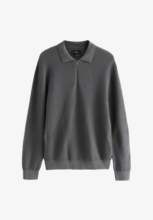 Šedý pulovr se zipem na límci, texturovaným vaflovým pleteným vzorem, žebrovanými manžetami a lemem, a volným střihem.