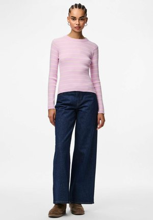 Pink striped ribbed long-sleeve top paired with wide-leg dark denim jeans and brown boots. Features a round neckline and fitted silhouette.