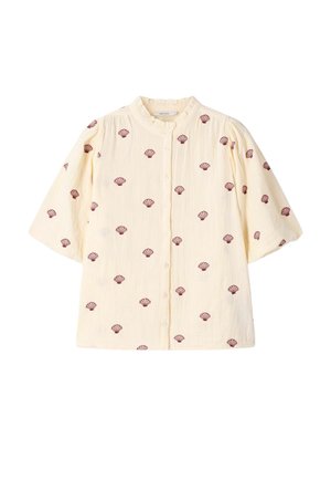 Crème korte mouwen blouse met knoopsluiting, gerimpelde kraag en een bordeauxrode schelpenprint over het geheel.