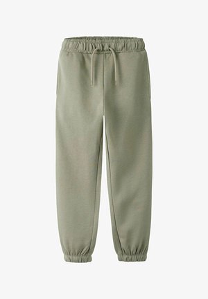 Šviesiai žalios spalvos siaurėjančios sportinės kelnės su elastinga juosmens juosta ir apačia. Yra reguliuojamas raištelis diržui bei šoninės kišenės. Minkštos audinio faktūros.