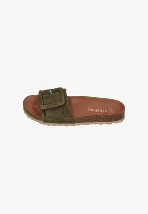 Olive green suede slide sandal with large square buckle, brown contoured footbed, cork midsole, and rubber outsole, labeled "VERBENAS."