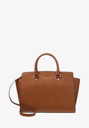 Sac à main en cuir marron Michael Kors avec double poignée, une bandoulière amovible et un logo doré à l'avant.