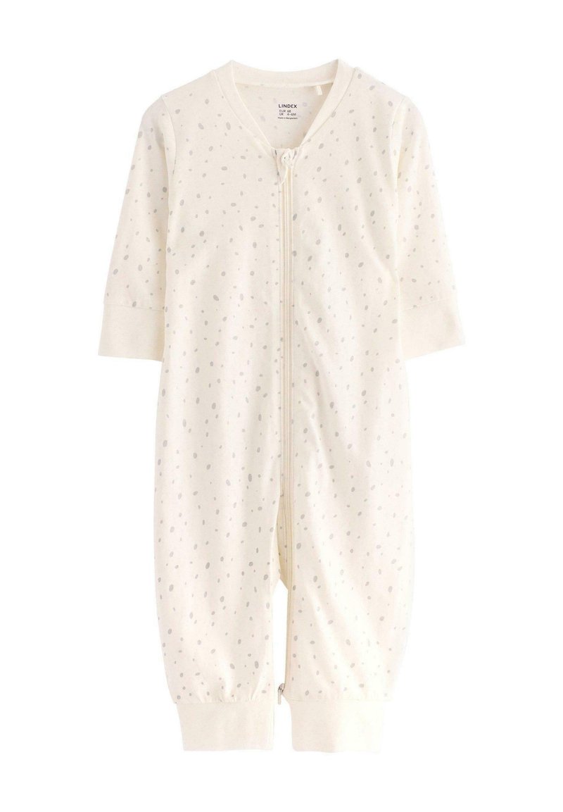 Tutina per neonati color crema realizzata in morbido tessuto, con zip frontale e motivo a pois grigio chiaro, maniche lunghe e polsini elasticizzati.