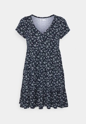 Vestido azul marino con mangas cortas y escote en V, con un patrón floral en blanco y verde, y un dobladillo acampanado. Tela ligera.