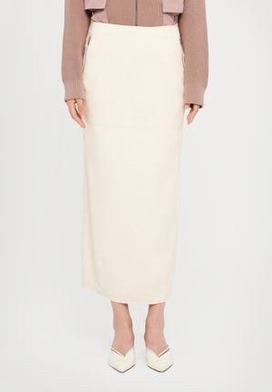 A floor-length cream skirt with a smooth texture, featuring side zip pockets and a sleek, simple design.