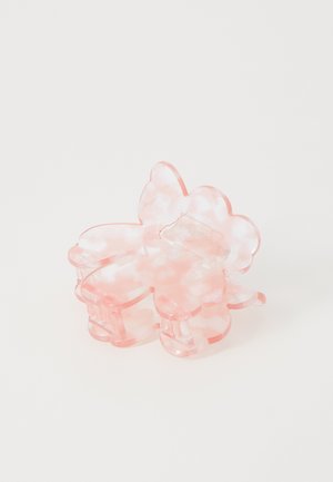 Clip para el cabello de acrílico marrón y blanco con un diseño marmoleado en forma de flor, con pétalos redondeados y un mecanismo de clasp para un agarre seguro.