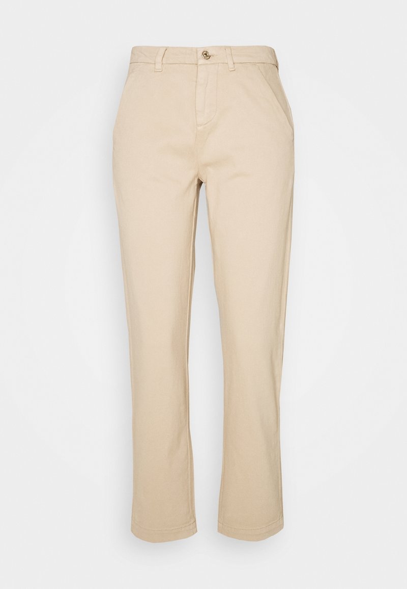 Beżowe bawełniane spodnie typu twill o prostym kroju, z zapięciem na guziki z przodu, szlufkami na pasek i wykończonymi mankietami. Gładka struktura na całej powierzchni.