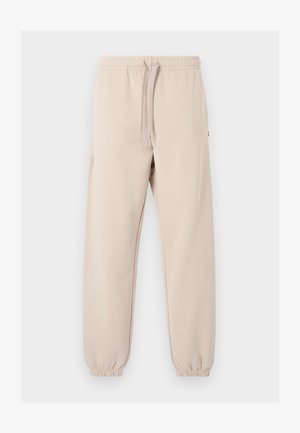 Beige joggingbroek met elastische taille en boorden, vooraan een trekkoord, gemaakt van zachte stof, geschikt voor vrijetijdskleding.