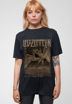 Black t-shirt featuring a large Led Zeppelin graphic with a winged figure, gold and beige accents, and "EST 1968" text at the bottom.