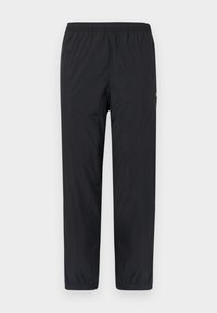 Pantaloni negri, ușori, cu talie elastică, cu picioare înguste și textură minimă. Prezintă cusături laterale și un logo mic pe piciorul stâng.
