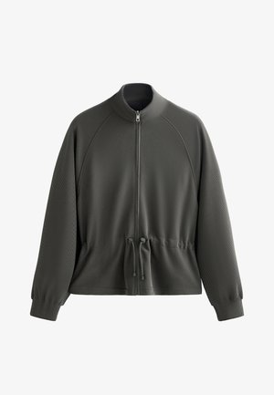 Siva zip-up jakna z visokim ovratnikom, raglan rokavi, teksturirana tkanina, nastavljiva vrvica na pasu in rebrasti manšeti.