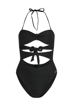 Melnas viengabala peldkostīms ar teksturētu apdari, kas iekļauj bezsiksnu dizainu, izgrieztas sekcijas un sasietu aizmuguri.