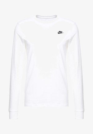 T-shirt blanc à manches longues en coton, arborant un petit logo noir de Nike sur la poitrine gauche et un col rond. Texture lisse.
