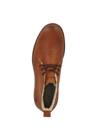 Braune Lederknöchelstiefel mit runder Zehenform, Schnürverschluss und weicher Fellfütterung. Mit genähter Sohle und einem Zughilfe-Anhänger für einfaches Anziehen.