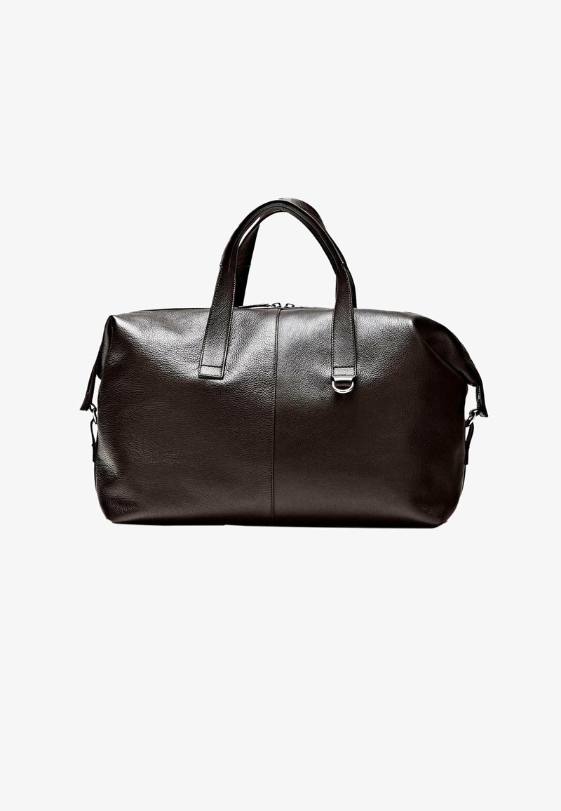 Black leather duffel bag with dual top handles, zipper closure, and a metal ring detail on the front handle.
