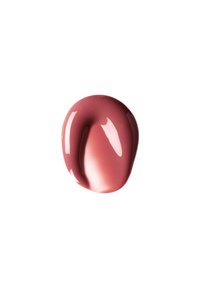 Creamy lip color in a soft rose shade, with a glossy finish and smooth texture, presented as a blob on a white background.