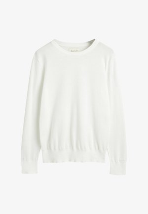 Maglione bianco in morbido materiale con scollatura rotonda, maniche lunghe e orlo a coste. Presenta un branding minimale sulla manica.