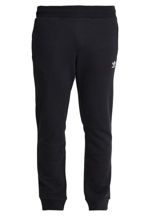 Černé tepláky Adidas s elastickým páskem, bočními kapsami, manžetami na kotnících a malým bílým logem Adidas na horní části levého stehna.