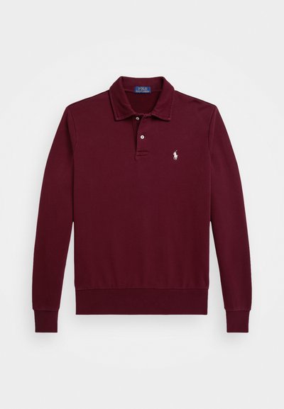 Polo à manches longues bordeaux en coton. Doté d'un col classique, d'une patte de boutonnage à trois boutons et d'un logo brodé sur la poitrine. Texture lisse.