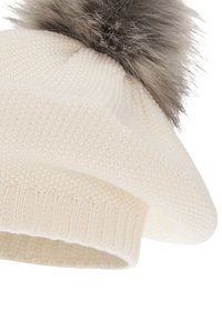 White knitted beret with a ribbed band and a faux fur pompom on top, featuring a textured pattern throughout the body.