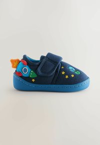 Felt slippers in navy blue with a blue sole. Features rocket ship and star embroidery in bright colors. Velcro strap for secure fit.