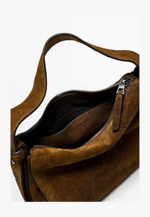 Brown suede handbag with a zip closure, smooth leather accents, and a single strap. Interior features a branded leather patch.