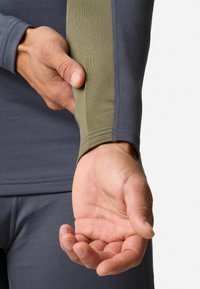 Long-sleeve athletic shirt featuring a dark gray body and olive green sleeve panel; smooth texture with flat seams for comfort.