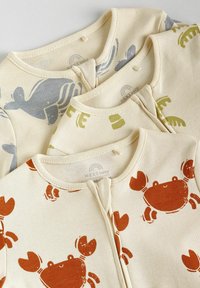 Set of three baby bodysuits in cream fabric featuring crabs, fish, and lobsters in orange, blue, and green prints. Round neck design.