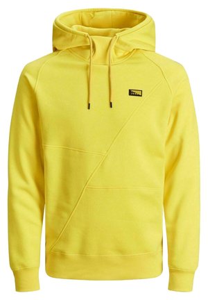 Žlutá mikina s kapucí vyrobená z bavlněné směsi. Má kapuci, stahovací šňůrky, přední klokánkovou kapsu a diagonální švy.