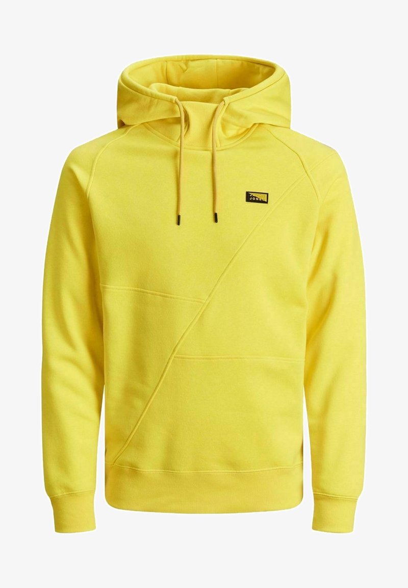 Žlutá mikina s kapucí vyrobená z bavlněné směsi. Má kapuci, stahovací šňůrky, přední klokánkovou kapsu a diagonální švy.