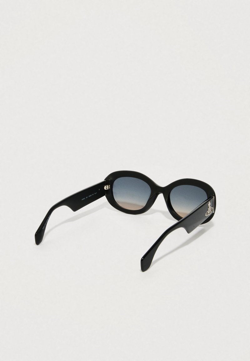 Black oversized sunglasses with gradient lenses, sleek plastic frame, and silver logo detail on the side. Smooth texture, modern design.
